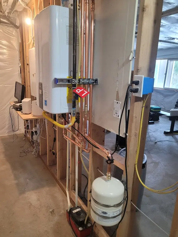 Licensed plumber repairing a kitchen sink in Traverse City