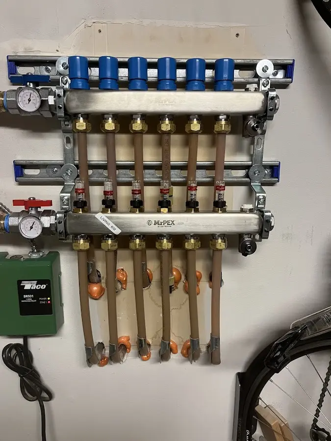 Plumber performing Water Heater Repair at a residential property in Traverse City